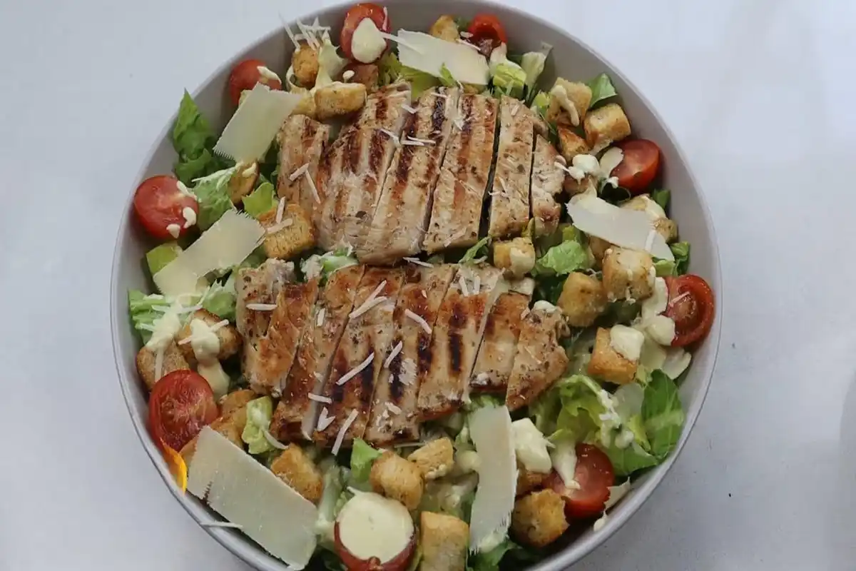 Discover how to make the perfect Chicken Caesar Salad with tips on dressing, ingredients, and variations!