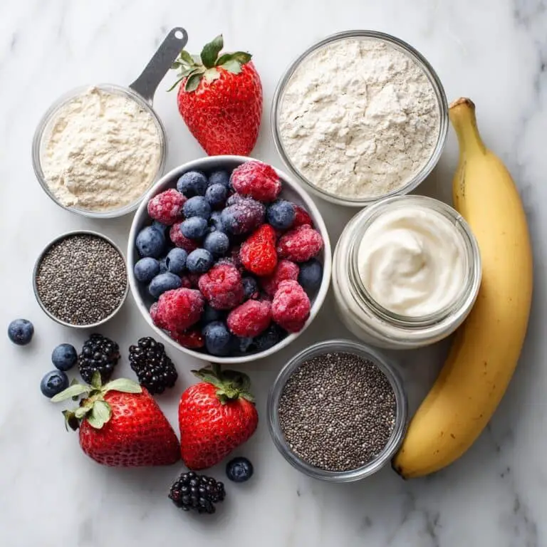 Smoothie ingredients: banana, berries, yogurt, and protein	