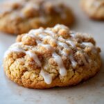 Close-up of a delicious Cozy Gilmore Girls Coffee Cake Cookie topped with streusel and a white icing drizzle.